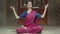 Meditating woman practicing yoga lotus pose