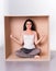 Meditating woman trapped in box concept