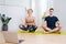 Meditation of adult siblings during isolation home, sitting in easy pose