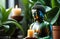 meditation, awareness and spirituality. small buddha statue among candles and house plants