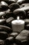 Meditation Candle Burning on Old Black Stones Path