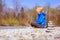 Meditation and relaxation: Cairn in the foreground, meditating woman in the blurry background. Enjoying the summer