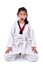 Meditative Asian girl in the Taekwondo school, isolated on white.