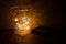 Meditative atmosphere corner with incense cone and lights painting from a glacier on the top of a concrete wall