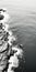 Meditative Black And White Aerial Photography Of Rocky Shore Waves