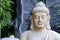 Meditative pose of a buddha statue face closeup. Peace concept