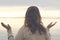 Meditative woman does yoga in front of the ocean