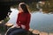 Meditative woman by lake