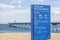 Mediterranean beach in Badalona, sign information platja pont pe