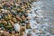 Mediterranean beach - colorful pebbles on the shore. Texture