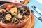 Mediterranean black pasta with shrimps, tomatoes, dumplings, rosemary and mushrooms