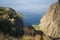 Mediterranean coast in Turkey, view of Butterfly Valley from Faralya, Lycian Way trail. Travel photo. Rocky cliff