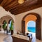 Mediterranean Coastal Villa: A Mediterranean-inspired villa with arched doorways, terracotta tiles, and a view of the sea1, Gene