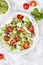 Mediterranean couscous salad with fried cherry tomatoes, cucumber