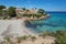 Mediterranean cove with a sandy beach and houses on the Costa Dorada in Spain