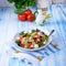 Mediterranean Farfalle salad with dry tomatoes and pine cores