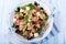 Mediterranean Farfalle salad with dry tomatoes and pine cores