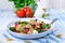 Mediterranean Farfalle salad with dry tomatoes and pine cores