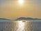 A Mediterranean ferry ship crossing the sea at sunset.