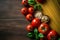 Mediterranean flavors, pasta, tomatoes on rustic background top view, border