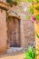 Mediterranean house wood entrance door with beautiful flowers