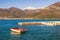 Mediterranean landscape on sunny winter day. Montenegro, Bay of Kotor. View of snow-capped mountain of Orjen