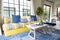 Mediterranean living room interior with bright yellow and blue sofa and pillow.