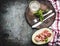 Mediterranean meal: melon with ham , wine and cutlery served on wooden cutting board