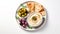 A Mediterranean mezze dish with pita bread, hummus, and olives is shown in a flat lay top view.