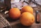 Mediterranean oranges on rustic background