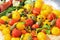 mediterranean products  yellow and red cherry tomatoes and capers