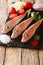 Mediterranean raw Triglidae, sea robins or gurnard fish with ingredients close-up on a slate board. vertical