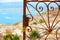 Mediterranean rusted gate with sea in background