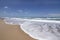 Mediterranean sandy beach. Sea waves incident on the shore.