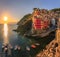 Mediterranean Sea, colorful boats and houses, Riomaggiore in Cinque Terre, Italy