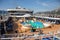 Mediterranean sea, Montenegro - 15.10.2018: Tourists relax at swimming pool at Cruise liner Norwegian Star during a