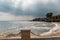 Mediterranean Sea in Northern Cyprus. Summer seashore with transparent blue water sun rays in the clouds. Seascape. Skyline