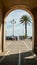 Mediterranean sea and the street with an archway in Nice