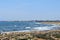 Mediterranean Sea in windy weather, rocky coast, resort town view