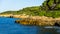 Mediterranean seashore structured by water and covered with trees near Tarragona, Spain