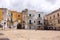 Mediterranean square with ancient buildings with television antennas. Italian traditional architecture. Bari town landmark.