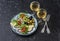 Mediterranean style antipasto and wine. Smoked salmon, avocado, arugula bruschetta, olives and two glasses of white wine