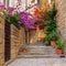 Mediterranean summer cityscape - view of a medieval street with stairs and flowers in the Old Town of Hvar