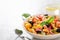 Mediterranean tomato salad panzanella with bread and fresh vegetables in the ceramic bowl.