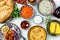 Mediterranean traditional meze: hummus, babaganoush, harissa, tzatziki on white background