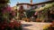 A Mediterranean villa with terracotta roofs and a courtyard filled with colorful flowers.