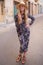 Mediterranean woman floral pattern dress posing