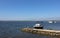 Mediterranian seaside view with small handmade pier and boats