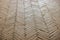 medium close up of Herringbone pattern pale brick pavement texture background
