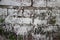 Medium close up of old brick wall at a former prison in Asia slo